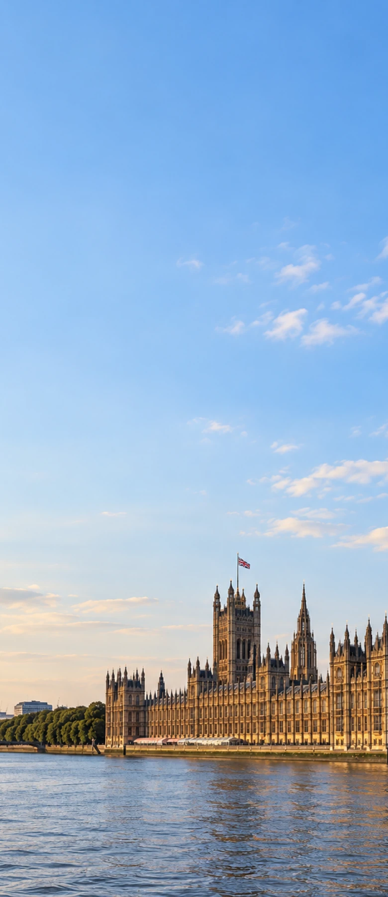 The Palace of Westminster and Elizabeth Tower on the River Thames, seat of the UK Parliament whose regulatory and legislative activity feeds the workflow automation Matterwire delivers into a team’s own systems.